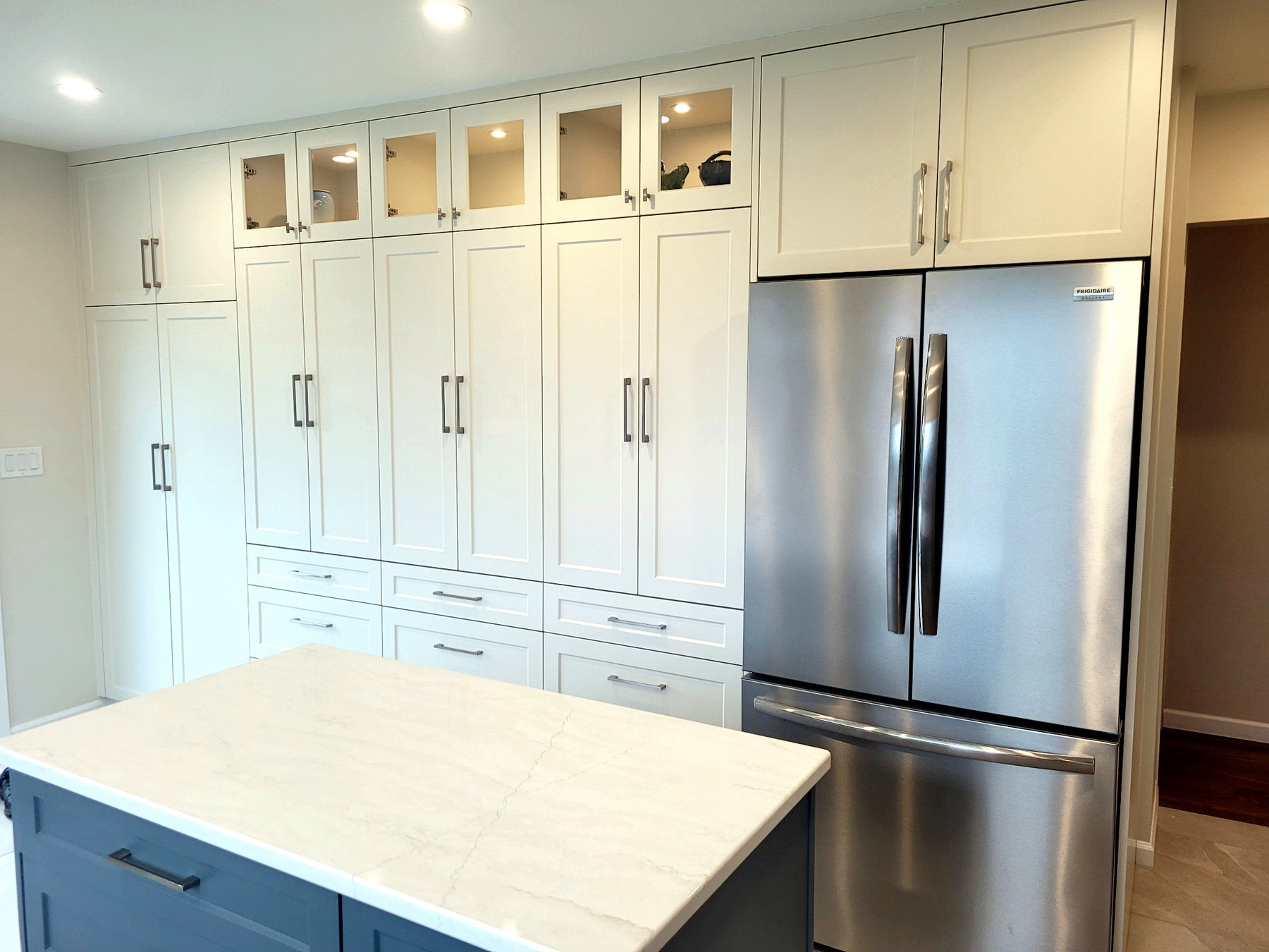 Kitchen renovation with enlarged window openings and improved natural light throughout the space