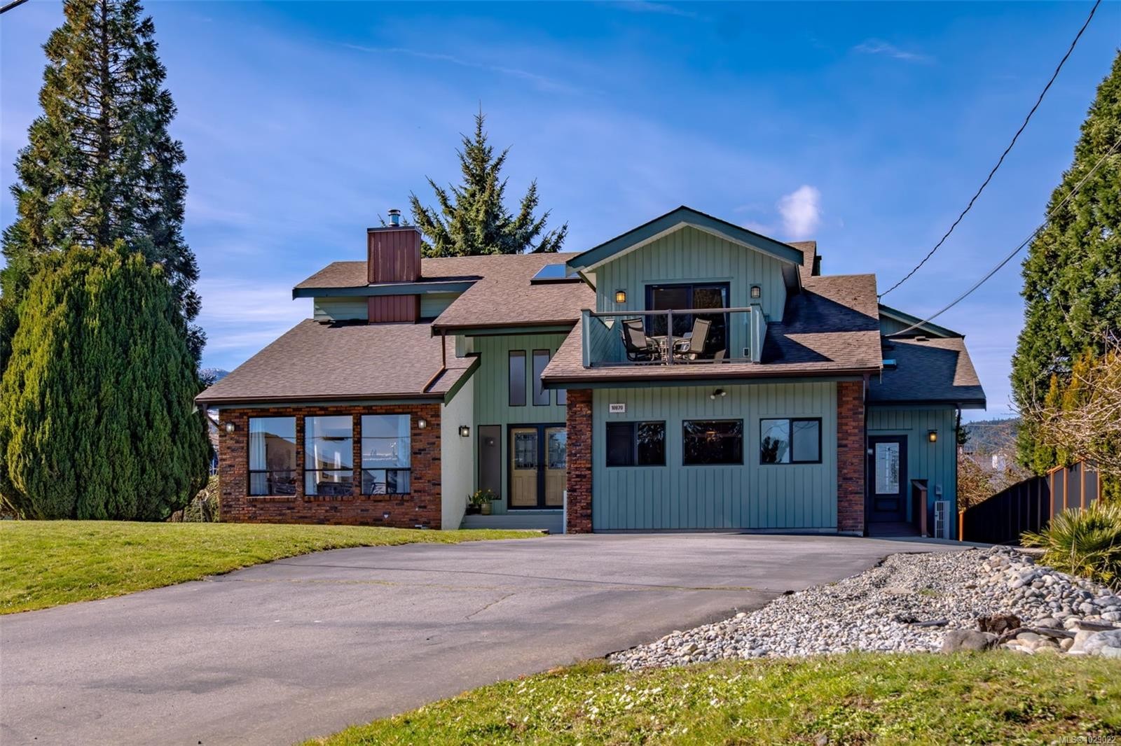Completed in-law addition in Chemainus with updated exterior, upper balcony, and added living space.